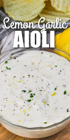 lemon garlic aioli in a glass bowl with crackers and parsley on the side