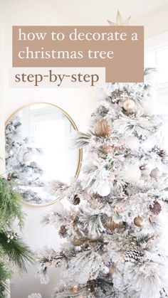 a white christmas tree with gold and silver ornaments on it, in front of a mirror