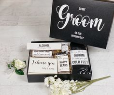 the groomsmid gift box is filled with personalized items for his wedding day