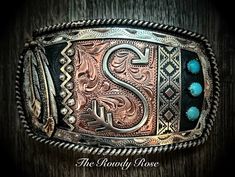 The Rowdy Rose specializes in the custom design of western belt buckles, jewelry, trophy awards and more. Customize any of our existing styles and add your own text, logo and unique flair for an item that you can find nowhere else on the market. All of our pieces are 100% hand-made and built to last a lifetime. Fill out the custom order form below to get started on your custom product design today! Custom Leather Belts Western, Artisan Engraved Belt Buckles As Gift, Artisan Engraved Belt Buckles For Gifts, Western Hand Tooled Belt Buckles As Gift, Handmade Western Belt Buckles As Gift, Handmade Western Belt Buckles For Gift, Big Belt Buckle, Cowgirl Belt Buckles, Cowgirl Lifestyle