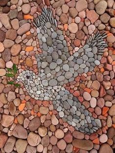 a bird made out of rocks and pebbles