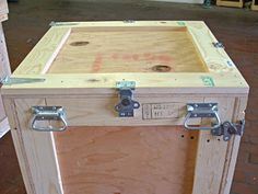 a large wooden box sitting on top of a hard wood floor