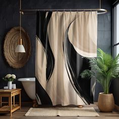 a black and white shower curtain in a bathroom with a potted plant next to it