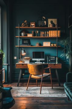 a desk with a computer on top of it next to a chair and bookshelf