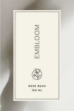 a white business card with the words embloom on it