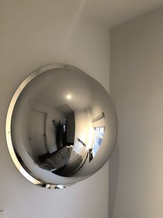 a mirror reflecting the inside of a room