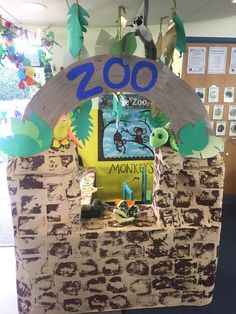 a cardboard zoo scene made to look like it's in the middle of a classroom