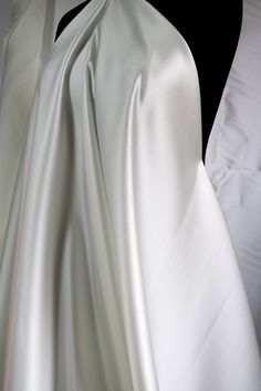 Elegant Satin Finish Fabric For Wedding, Elegant Satin Fabric For Wedding, Elegant Wedding Fabric With Satin Finish, Elegant Wedding Satin Fabric, White Satin Finish Fitted Gown, Wedding Silk Fabric With Satin Finish, Elegant Cream Fabric For Wedding, White Silk Gown For Ceremonies, Cream Silk Fabric For Wedding