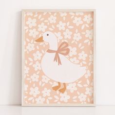 a duck with a bow on its neck is standing in front of a flowered background