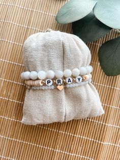 Custom neutral bracelet stack This bracelet stack is super cute and trendy. You are able to choose the word that you want and make it personal. Such a cute expression of faith. Please choose the color for the word bracelet. If you need a size other than 7 please leave that in the box too. The average size for a female is 7 inches. To measure your wrist: *Take a piece of yarn and measure around your wrist with the yarn and then measure the yarn in inches to get your wrist measurement. These are d Bachelorette Beaded Bracelets, Inspirational Adjustable White Name Bracelet, Inspirational White Bracelets For Friendship, Inspirational White Adjustable Name Bracelet, Inspirational Adjustable Stretch Bracelet, Inspirational Adjustable Stretch Bracelet For Everyday, White Hypoallergenic Friendship Bracelets For Everyday, Meaningful White Adjustable Beaded Bracelets, Meaningful White Adjustable Friendship Bracelets