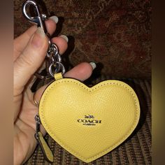 *Nwt-Coach-Heart Bag Charm/Coin Purse-Keychain-Light Yellow-$128: *Product Details: Crossgrain Leather Color: Light Yellow Zip Closure Silver-Tone Hardware Attached Split Key Ring & Dogleash Clip Fabric Interior Lining 3-1/2" L X 3" H X 0.5" W Style: Cp368 Msrp $128 + Tax *Smoke-Free Home. *Shipped Promptly-Usually The Same Day As Purchased. If Not Possible, Then Item Will Be Shipped Out The Next Available Business Day. Coin Purse Keychain, Purse Keychain, Coach Keychain, Heart Bag, Love Charms, Coach Accessories, Key Card Holder, Light Yellow, Key Ring