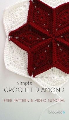 the crochet star is on top of a white doily with red trim