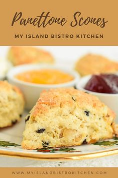 some scones are on a plate with fruit