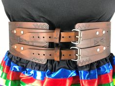 Our traditional hand-stamped leather belts are handcrafted with the utmost attention to detail and quality: Made from 9-10 oz vegetable-tanned leather (extremely thick) 4 inches wide Belts are adjustable up to 4 inches Intricate floral and geometric pattern stamping designs created by our Indigenous design team Hand dyed in-house in a range of natural finishes Require regular oiling to maintain durability and longevity (recommended oiling once a year) Custom-made: each belt will be slightly diff Belt Crafts, Leather Belt Crafts, Indigenous Design, Belt Collection, Belt Making, Powwow Regalia, Jingle Dress, Wide Belts, Stamped Leather