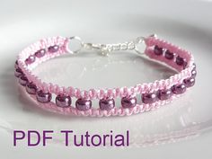 a pink beaded bracelet with silver beads