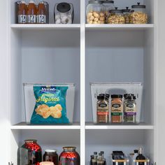 the pantry shelves are filled with various foods and condiments, such as cookies