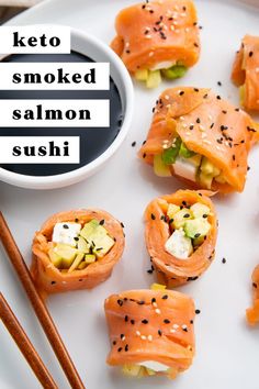 salmon sushi on a plate with chopsticks next to it and the words keto smoked salmon sushi