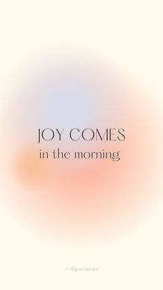 the words joy comes in the morning on a blurry white and pink background with an orange circle