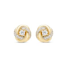 These gorgeous love knot earrings make a meaningful gift for any occasion. A round diamond twinkles at the center, while swirls of round diamonds styled in 10K yellow gold and white rhodium complete the classically beautiful design. The earrings have a total diamond weight of 1/6 carat and secure with friction backs. Knot Stud Earrings, Knot Studs, Knot Earrings, Love Knot, Diamond Fashion, Meaningful Gifts, Round Diamond, Round Diamonds, Beautiful Design