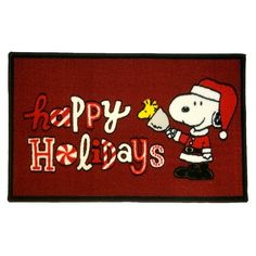 a red door mat with a cartoon character holding a candy bar and the words happy holidays written on it