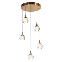 three lights hanging from a ceiling fixture with white glass globes and gold metal fittings