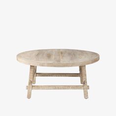 an oval wooden table with two legs on one side and a round top on the other