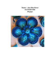 a blue flower is shown in the middle of a page