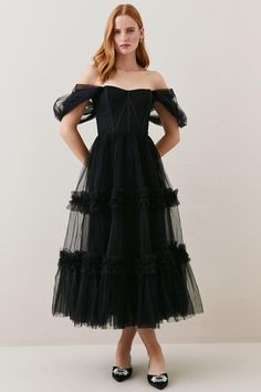 Imbued With Artisanal Allure And Dark Romance, This Captivating Tulle Dress Promises To Make An Entrance At Your Next Event. A Draped Corset Bodice Cinches The Waist, Adding A Sultry Element, While The Tiered Tulle Skirt Flares Out To Create A Dramatic Silhouette Which Exudes High-End Glamour.Tiered Tulle Skirtcorset Bodicedraped Mesh Sleeves Ruched Organza Party Dress, Organza Ruched Party Dress, Black Tulle Corset Dress For Summer, Fitted Corset Dress With Tulle Skirt For Cocktail, Evening Corset Dress With Tulle Skirt And Sweetheart Neckline, Strapless Corset Dress With Tulle Skirt For Evening, Strapless Tulle Corset Dress For Evening, Overbust Tulle Corset Dress For Gala, Cocktail Dress With Corset Back And Tulle Material