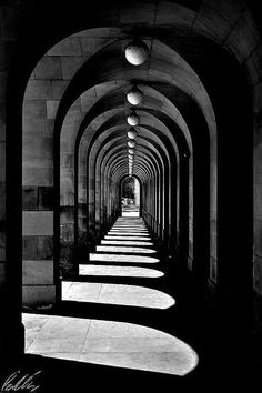 black and white photograph of an arched walkway