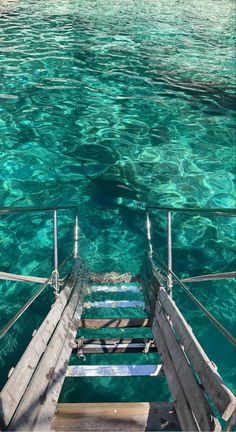 stairs lead down to the clear blue water