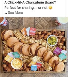 a box filled with lots of different types of food on top of a wooden table