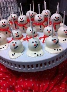 there are some cake pops with snowmen on them