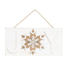 a wooden sign that says joy with a snowflake on it