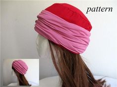 a woman's head wearing a pink and red turban with long hair