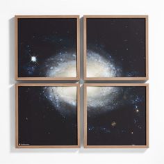 four square pictures with the image of a spiral galaxy in it's center are hanging on a wall