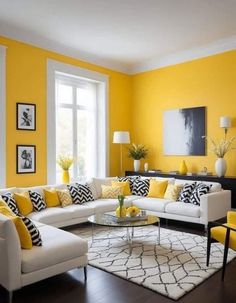 a living room with yellow walls and white furniture in the center, along with black and white rugs