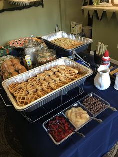 several trays of food on a table