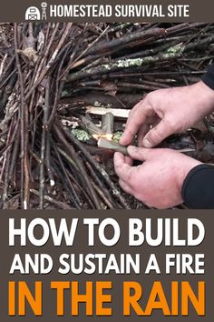 a man is building a fire in the rain with sticks and twigs to make it look like he's working on something