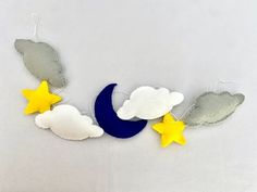 the moon and stars are hanging on the wall