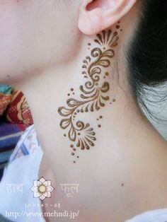 a woman with henna on her neck