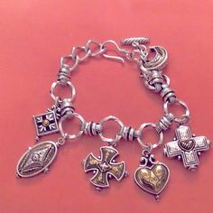 Statement Brighton Charm Bracelet Includes Maltese Cross, Heart, Crescent Moon And Other Totem's By Brighton. Six Charms In All - Sizing (Goes 7.25-8" In) With Toggle Closure. Two Tone (So The Deeper Brass And The Silver Colors Both Present). Heavy Piece Weighing In Around 62 Grams! Retired Piece, Has A Gothic Or Victorian Look To It. Silver Plated From Brighton Beautiful Details - Great Quality Of Course, Brighton Pieces Are Super. Nwot, Perfect Condition. Retail Price: $98 Offers Welcome Maltese, Brighton, Brighton Charm Bracelet, Cross Heart, Maltese Cross, Brighton Jewelry, Charm Bracelets, Crescent Moon, Womens Jewelry Bracelets