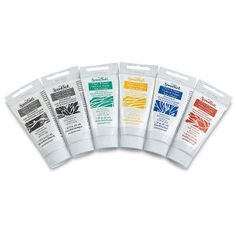 five different types of toothpaste on a white background