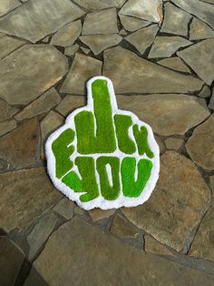 a green sticker that says rock you on it