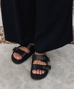 Hutton Slide Sandal Black Laid-back and made to last a lifetime, the Hutton Slide Sandal is the definition of an everyday staple shoe. Featuring classic vegetable-tanned cowhide leather and our signature push-button detailing, they pair perfectly with everything from vintage denim to simple slip dresses. Leather upper with molded leather footbed. Made in Portugal. | Jenni Kayne Women's Hutton Slide Sandal Size 39 Everyday Closed Toe Leather Sandals, Leather Sandals With Leather Lining For Everyday, Classic Sandals With Leather Footbed For Everyday, Classic Everyday Sandals With Leather Footbed, Classic Leather Footbed Sandals For Everyday, Classic Sandals With Leather Footbed, Classic Leather Sandals For Everyday, Workwear Sandals With Removable Insole And Single Toe Strap, Classic Leather Sandals For Work