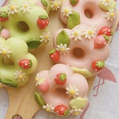 there are many doughnuts with flowers on them