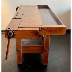 an old wooden table with a drawer on the top that has been turned into a workbench