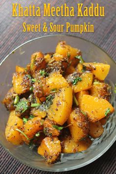 a glass bowl filled with sweet and sour pumpkins