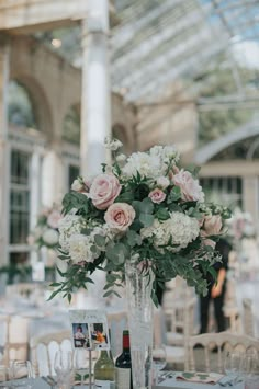 a vase filled with flowers sitting on top of a table