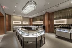 the inside of a jewelry store filled with lots of counter tops and glass cases on display