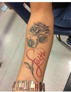 a person with a rose tattoo on their arm